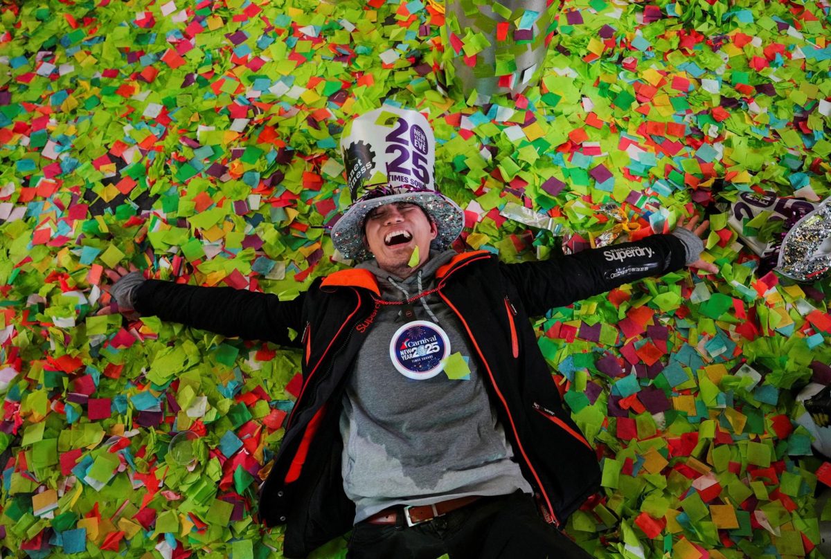 Man in confetti from CNN World photo album "New Year's celebrations around the world"