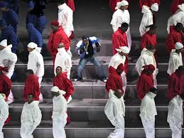 Dancers forming a split American flag with Kendrick in the center